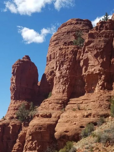 Red rock formations under a clear blue sky.