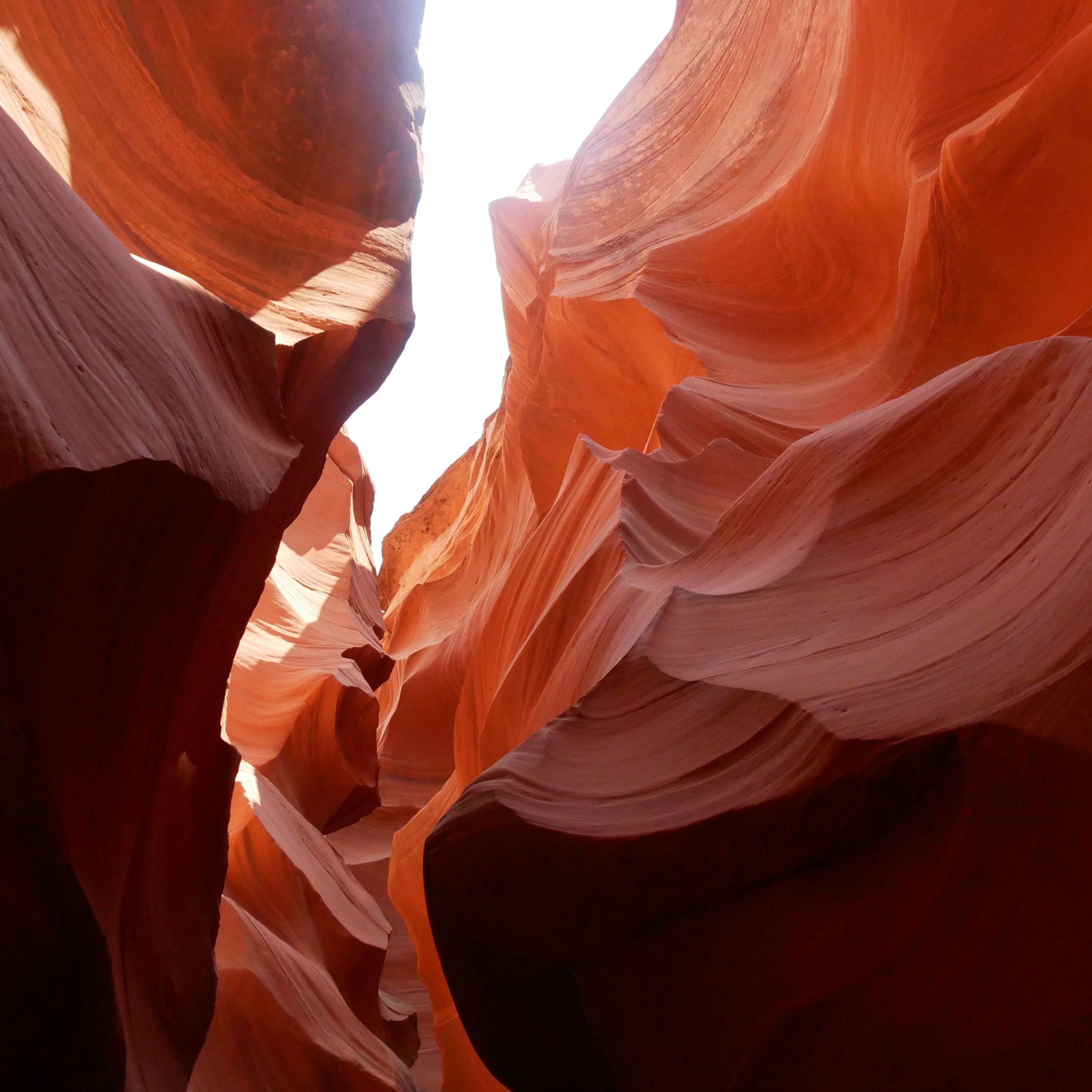 Sunlit red rock formations of Antelope Canyon.